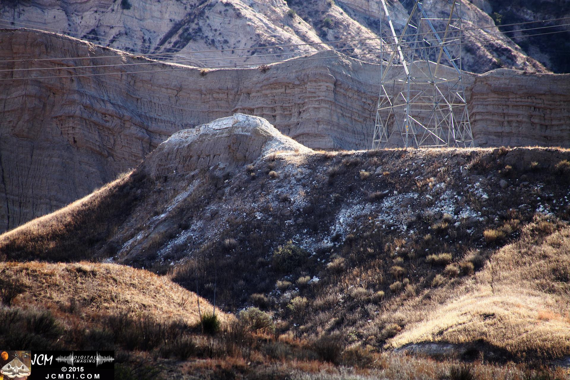 Landslide, buckled pavement, and terrain at Vasquez Canyon Road in Santa Clarita, CA filmed 11-25-2015